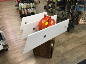 White poly board planer and planer reel. 
